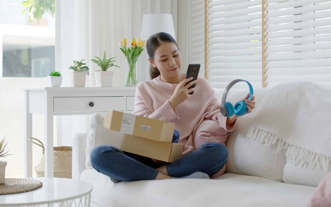 A customer interacts with a recently purchase pair of headphones.